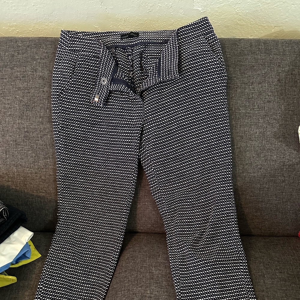 Women’s navy blue and white dress pants.